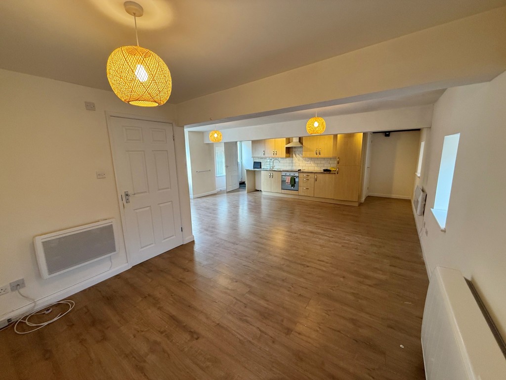 Lot: 194 - VACANT FREEHOLD TOWNHOUSE WITH PARKING - Alternative view ground floor living space and kitchen